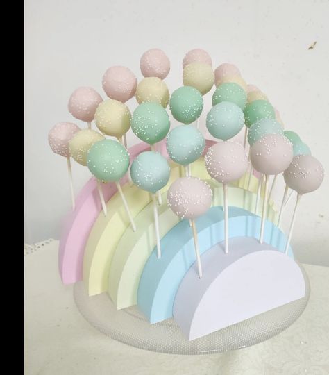 Cakepops colocados em estrutura de esferovite Cake Pops Pastel Colors, Rainbow Birthday Dessert Table, Pastel Rainbow Bridal Shower Ideas, Pastel First Birthday Cookies, Care Bear Cake Pops, Pastel Rainbow Centerpieces, Pastel Rainbow Cake Pops, Pastel Rainbow Birthday Theme, Rainbow Theme Gender Reveal