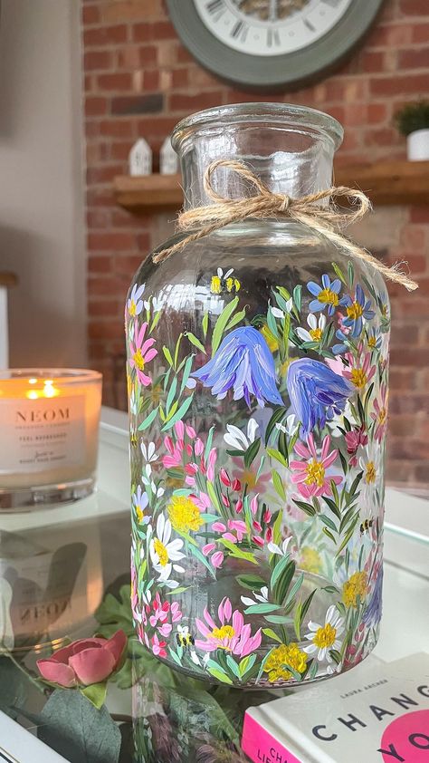 Two Peas | ‘She is like a wildflower, beautiful, fierce and free’. Our new wildflower design will be going live soon! We’ve painted this one a little… | אינסטגרם Glass Paint Designs, Things To Paint On Glass Bottles, Glass Painting Jars Ideas, Money Jar Painting Ideas, Painting Ideas On Vase, Painting On Jars Glass Bottles, Jars Painting Ideas, Painting Glass Vases Diy, Painted Glass Jars Diy