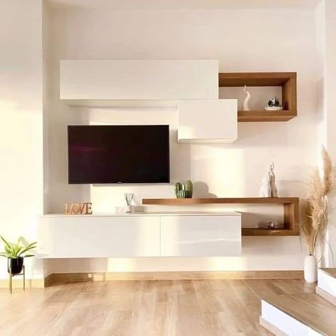 Tv Unit Design | Interior Design ✨️ . . . . . . #trendingpost #myinterior #lightingdecor #explorepost #tvwalldesign #tvunit #interiors #livingroomdesign #homesweethome #tvunitdesign #sethiglassplywood #homedecor #modernlighting #interiordecor #interiordesign #luxurylifestyle #tvcabinetdesign #luxuryhomes #hairstyletutorial #taarezameenpar #mehndidesigner #icct20worldcup #srhvsgt Dnevni Boravak Ideje Moderno, Wall Cabinets Living Room, Family Friendly Living Room, Tv Unit Furniture Design, Small Living Room Layout, Built In Shelves Living Room, Shelf Decor Living Room, Living Room Tv Unit Designs, Tv Room Design