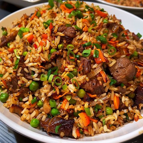 🍚 Indulge in the rich flavors of Oxtail Fried Rice! 🍖✨ #OxtailFriedRice #FlavorfulEats Oxtail Fried Rice Ingredients: Oxtail, cooked and shredded (1 lb) Cooked rice (4 cups) Garlic, minced (3 cloves) Onion, chopped (1) Carrots, diced (1 cup) Peas (1 cup) Soy sauce (3 tbsp) Oyster sauce (2 tbsp) Sesame oil (1 tbsp) Green onions, chopped (1/2 cup) Oil (for frying) Instructions: Heat oil in a large pan or wok over medium heat. Sauté garlic and onion until fragrant. Add carrots and peas, cook... Oxtail Fried Rice, Fried Oxtails, Fried Rice Ingredients, Best Fried Rice Recipe, Fried Recipes, Soul Food Dinner, Tasty Recipes Videos, Cooked Rice, Rice Ingredients