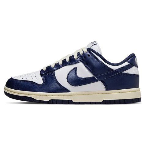 The Nike Women’s Dunk Low ‘Vintage Navy’ dresses the retro silhouette in a two-tone palette that channels the look and feel of the original ‘Be True to Your School’ series from 1985. The low-top sports a smooth white leather upper, accented with Midnight Navy overlays and a color-matched Swoosh. The sneaker is mounted on durable [...] Nike Dunk Low Vintage Navy, Adidas Spezial, Exclusive Sneakers, Marathon Running Shoes, Nike Dunk High, Nike Shox, Air Jordan 3, Nike Air Max Plus, Jordan 5