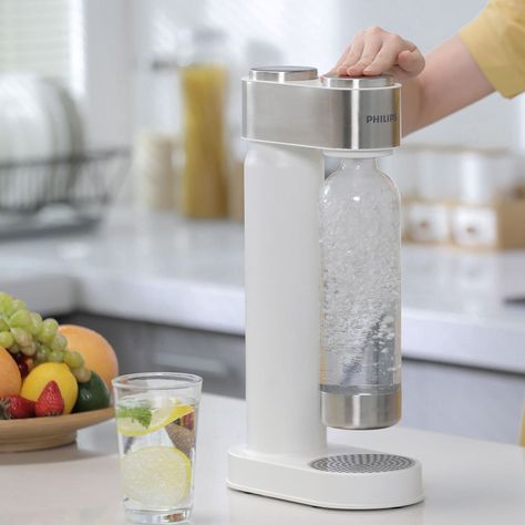 This white Philips Soda Maker lets you enjoy fresh, homemade sparkling water in three easy steps as well as allows you to customise the carbonation level to suit your personal taste. It comes with a 1 litre PET bottle, which is reusable and helps to reduce how often you reach for single use bottles of sparkling water. Soda Maker, Sparkling Drinks, Soda Stream, Water Machine, Fizzy Drink, Blog Layout, Kitchen Must Haves, Maker Shop, Family Table