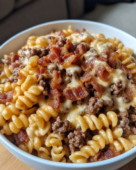 Loaded Bacon Cheeseburger Pasta 🍝🥓🧀 Ingredients: - 1 lb ground beef - 2 cups cooked pasta - 1 cup shredded cheddar cheese - 1/2 cup cooked bacon, crumbled - 1 cup milk - 1/4 cup flour - 1/4 cup ketchup - 1 tablespoon Worcestershire sauce - Salt and pepper to taste Instructions: 1. In a large skillet over medium heat, cook the ground beef until browned and fully cooked. Drain any excess fat. 2. Sprinkle the flour over the cooked beef and stir well to combine. 3. Gradually add the ... Loaded Cheeseburger Pasta, Cork Screw Pasta Recipes, Ground Beef Over Rice, Loaded Bacon Cheeseburger Alfredo Pasta, Loaded Bacon Cheeseburger Pasta, Meat Based Meals, Pasta Recipes With Beef, Pasta Dishes With Ground Beef, Beef Cavatappi