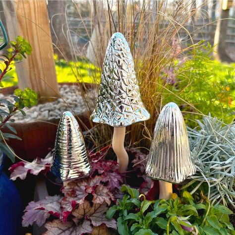 Let your garden tinkle with delight! Bosmere's Tinkling Toadstools aren't just garden decor, they're whimsical weatherproof wonders! Glazed in shimmering sun-kissed hues or elegant metallics, these charming ceramic toadstools dance in the breeze, their gentle chimes adding magic to your outdoor space. Rain or shine, these enchanting fungi stand tall, welcoming fairies, butterflies, and a touch of whimsy to your leafy haven. So, ditch the ordinary and sprinkle some sparkle (and tinkles!) into you Goth Plants, Ceramic Toadstools, Concrete Creations, Ceramic Mushroom, Garden Goals, Deck Decor, Decorative Garden Stakes, Painted Clay Pots, Painted Clay