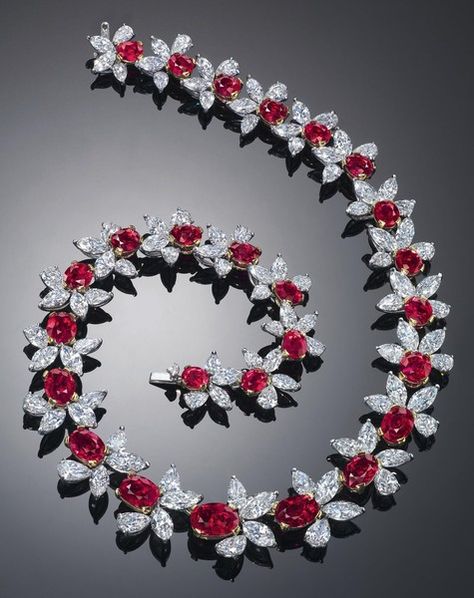 'RED SCARLET' - A SUPERB PIGEON BLOOD RUBY AND DIAMOND NECKLACE BY JAMES W. CURRENS FOR FAIDEE Designed as twenty-six graduated Oval-shaped Rubies weighing approximately from 5.38 to 1.27 carats, each accented by a cluster of Marquise and Pear-shaped Diamonds, mounted in Platinum and 18K Yellow Gold, 39.4 CM long. The total weight of the certified Rubies is 62.46 carats. [Sold for  5.2 million U.S.] Expensive Necklaces, Kristina Webb, Ruby And Diamond Necklace, Blood Ruby, Red Stones, Luxury Jewelry Brands, Ruby Bracelet, Gold Rings Jewelry, Ruby Necklace