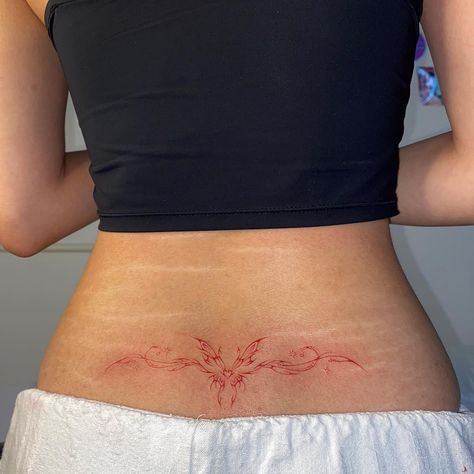 Tattoo by @tattingtoo on IG Red Ink Rib Tattoo, Red Tramp Stamp Tattoos, Lower Back Dragon Tattoo, Blurred Tattoo, Light Blue Tattoo, Belly Tattoo Ideas, Subtle Anime Tattoos, Tattoo Ideas Red, Tattoo Belly