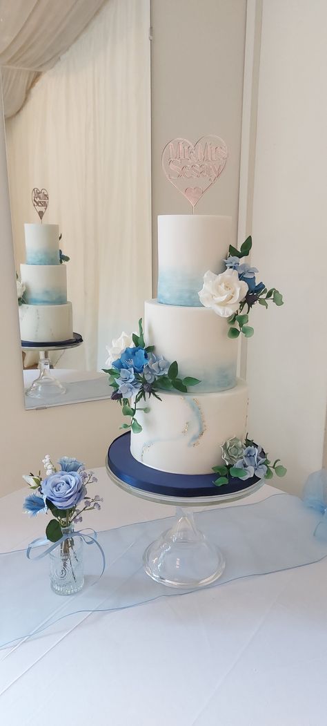 Blue, roses, poppies, hydrangea , sea thistle  all in sugar.  Marbling, watercolour tall and elegant Dusty Blue Simple Wedding Cake, Wedding Cake Designs 2 Tier Blue, 2 Tier Elegant Wedding Cake, Simple Dusty Blue Wedding Cake, 3 Tier Wedding Cake Dusty Blue, Watercolour Wedding Cake, Wedding Cake 2 Tier Blue, White Blue Wedding Cake, Ube Wedding Cake