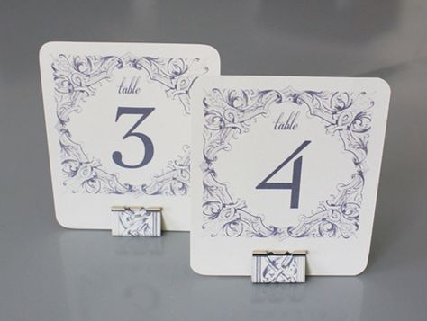 Printable table number templates with matching stands made from office binder clips. Diy Table Number Stands, Wedding Budget Template, Free Printable Wedding Invitations, Framed Table Numbers, Table Numbers Wedding Diy, Table Number Stands, Diy Table Numbers, Printable Table Numbers, Diy Wedding Table