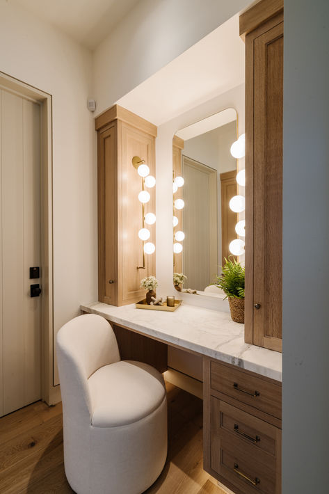 Rift and quartered white oak custom makeup vanity with inset drawers and cabinets, quartz countertop, sphere vanity lighting, and white swivel chair. #thedendesigngroup #bayareainteriordesign #makeupvanity #whiteoakvanity #vanitylighting #luxurydesign Bathroom With Vanity Ideas, Vanity Alcove Bedroom, Vanity In The Bathroom, Bathroom Vanity With Raised Sink, Build In Makeup Vanity, Built In Beauty Vanity, Vanity With Seating Master Bath, Vanity With Top Storage, Master Makeup Vanity