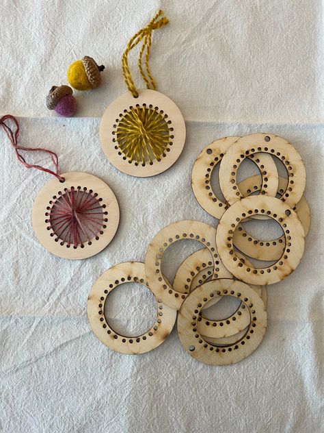 These adorable loom ornament blanks will add some weaving inspired flair to your holiday tree! These little looms make a great handmade gift, and there are so many different ways you can use them. The holes in each ornament are left unstitched so you can weave, crochet or stitch them in with a needle or hook and yarn or embroidery floss. The possibilities for how to adorn these are limitless. Pair them with our Rustic Wool Threads, or display a bit of your favorite handspun! Sold individually. P Weaving On Wood, Woven Ornaments, Montessori Sewing, Wood Weaving, Embroidery On Wood, Yarn Ornaments, Wood Laser Ideas, Wood Embroidery, Crocheted Cardigan