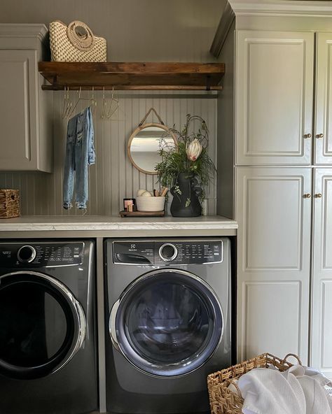 See what magic a little paint can do? This laundry room began as nothing remarkable, but through the simple acts of removing a few cabinets and introducing beadboard, a hanging rod, charming hardware, and wall-to-wall countertops, it’s a whole new room. Not only is it visually transformed, but it’s now exponentially more practical as well. ✨ • • • #interiordesign #endlesspossibilities #designforeveryone #interiors #midwestdesigner #AKDesignStudio #akdsjadestoneplace #laundryroommskeover Laundry Room Ideas Hanging Rod, Laundry Room With Hanging Rod, Beadboard Laundry Room, Laundry Room Colors, Bead Board Walls, House Updates, Laundry Room Inspiration, Hanging Cabinet, Light Ideas