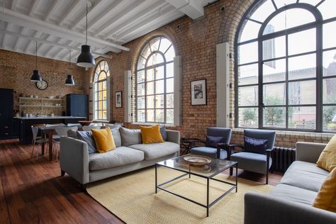 The reimagined warehouse apartment, with an open-plan living space, and master bedroom on one level.... Warehouse Apartment, Manhattan Loft, Warehouse Living, Warehouse Loft, Modern Industrial Interior, Casa Loft, Industrial Apartment, Loft Interior, Timber Beams