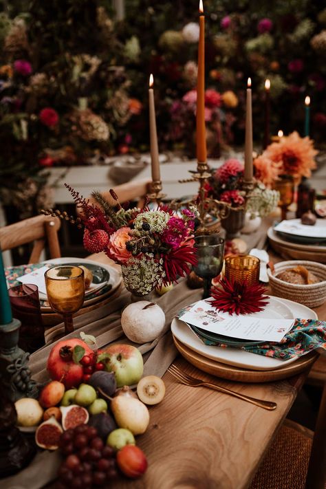 Neutral-toned tablerunner on rustic wooden table, orange, green and red coloured glasses, earthenware, seasonal fruit and vegetables, red, brown and green tapered candles in gold candlesticks and clear vases with autumnal coloured flowers | Nicola Dawson Photography Gold Candlesticks, Autumn Wedding Inspiration, Glass House Wedding, Fall Wedding Tables, Fruit Wedding, Autumnal Wedding, Fall Brunch, Seasonal Fruit, Tapered Candles