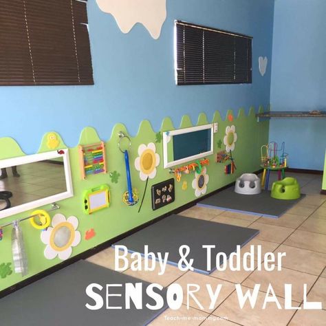 https://www.teach-me-mommy.com/sensory-wall/ Toddler Daycare Rooms, Infant Room Ideas, Infant Room Daycare, Daycare Room Ideas, Infant Toddler Classroom, Daycare Setup, Church Nursery Decor, Kids Church Rooms, Daycare Spaces