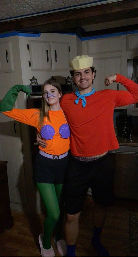 Barnacle boy costume from Spirit Halloween. Mermaid man costume from amazon. The shell bra was hand painted. Shark Boy Lava Girl Costume College, Spooky Pizookie, One Piece Couple Costume, Mermaid Man And Barnacle Boy Costume, Mermaid Couple Costume, Barnacle Boy Costume, Mermaid Man Costume, Under The Sea Outfit, Creative Couples Halloween Costumes