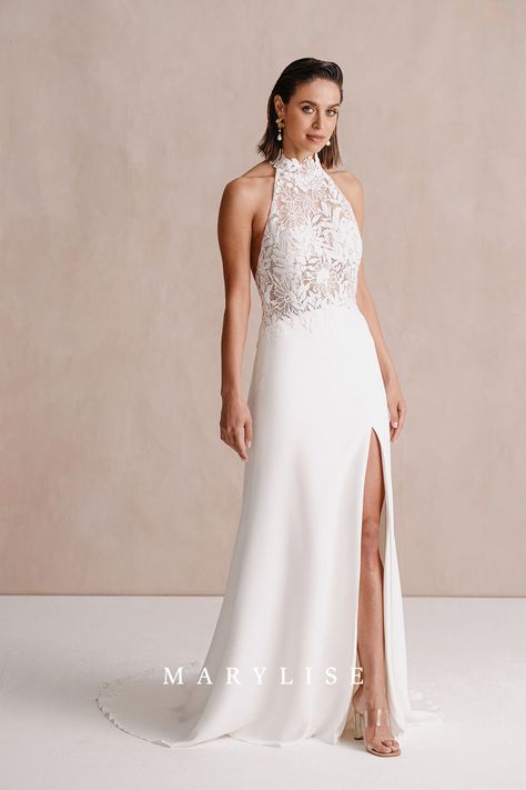 Bonneval 2 has a halter top made of flower embroidery and an open back. This elegant, feminine wedding dress has a crepe skirt, sensual split, and court train. The edge of the train has the same lace applications as the top. #bridetobe #weddingdress #sophisticatedweddingdress #elegantweddingdress #feminineweddingdress #modernweddingdress #modernbride #weddingphotography #vneckweddingdress #mermaidweddingdress #ballgownweddingdress #openbackweddingdress #laceweddingdress #trendyweddingdress Feminine Wedding Dress, Celebrity Bride, Feminine Wedding, 2025 Wedding, Crepe Skirt, Open Back Wedding Dress, Bridal Elegance, Crepe Skirts, Trendy Wedding Dresses