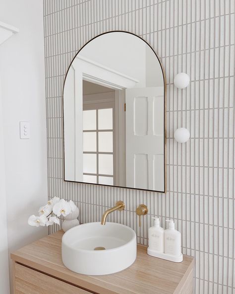 Our top tips for nailing the scandi bathroom look: ✔️ Choose light, cool grey & earthy-toned tiles on floors & create a feature wall with a white mosaic or subway tile ✔️ Choose light coloured timber vanity in pine or oak ✔️ Position mirrors to reflect light ✔️ Bring in small elements of metal such as gold or copper ✔️ Style with whites and cool greys @bungalow_on_seventh created this perfect scandi look featuring our Haifu White Mosaic paired with hints of gold, pine vanity and white styling. Mirror Accent Wall, Scandi Bathroom, Metal Bathroom, Vanity Wall Mirror, Downstairs Bathroom, Bathroom Renos, Laundry In Bathroom, Bathroom Vanity Mirror, House Bathroom