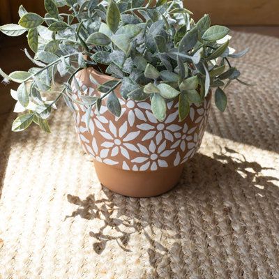 Create a traditional boho aesthetic with this whimsical terracotta pot exclusively from Foreside Home and Garden. Hand thrown by artisans in India, this planter is characterized by a dainty white flower pattern that is hand painted and stands out against the natural terracotta clay background. Add a touch of warmth to your indoor and outdoor spaces. | Foreside Home & Garden Terracotta Pot Planter 6.0 x 6.0 x 6.0 in | AORE5752 | Wayfair Canada Terracotta Pots Front Yard, Fun Flower Pots, Terracotta Pot Paint, Decorated Terra Cotta Pots, Terracotta Planter Painting Ideas, Terra Cotta Pot Painting Ideas, Flower Pots Painting Ideas, Painting Planters Pots Ideas, Painting On Flower Pots