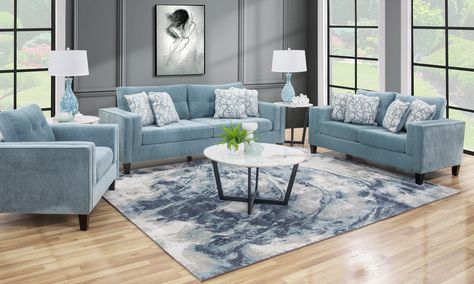 Fabric: 100% Polyester CC: WS Contemporary styled group upholstered in a teal polyester fabric. Features track arms with inside padding, tufted seat and back cushions, and unique welting. Sofa includes 4 trendy teal and white throw pillows. Beach Themed Living Room, Coastal Casual Living Room, Blue Living Room Inspiration, Teal Sofa Living Room, Cozy Coastal Living Room, Small Space Interior, Summer Living Room Decor, Space Interior Design, Beach Theme Living Room