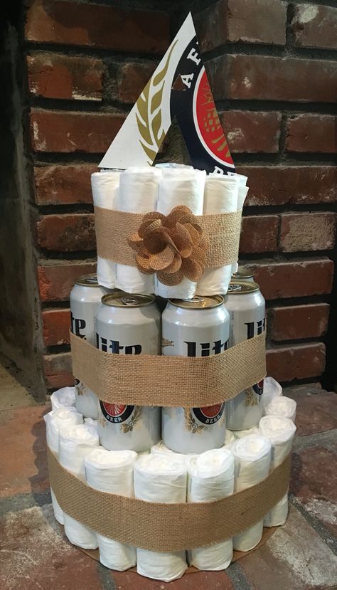 Diaper and beer party cake! Miller lite diaper cake :) Beers And Diapers Party, Men’s Diaper Party Ideas, Diaper Bash Ideas, Diapers And Beer Party Ideas, Diaper Keg Party Decor, Pregger Kegger Decorations, Diapers And Wipes Baby Shower Ideas, Pregger Kegger Ideas, Diaper Party Themes