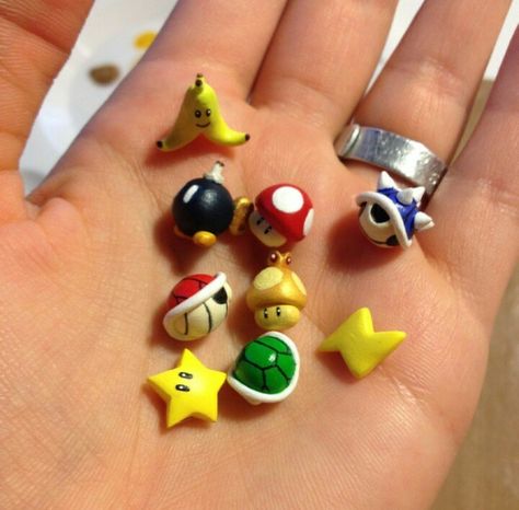 Mario Kart Items :) Mario Clay Charms, Super Mario Clay Sculptures, Polymer Clay Super Mario, Gamer Clay Ideas, Mario Clay Art, Super Mario Clay Art, Clay Mario Characters, Nintendo Clay Ideas, Mario Clay Ideas