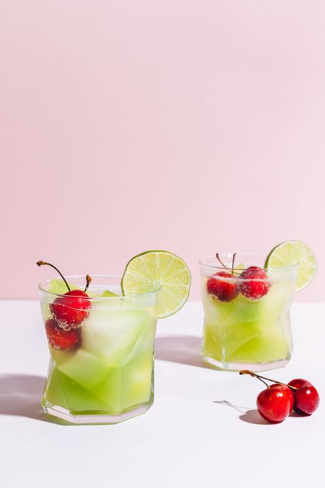 Two glasses of our Citrus & Melon Spritzer with fresh cherries in the glasses Summer Drinks Alcohol Recipes, Melon Recipes, Best Summer Cocktails, Summer Drinks Alcohol, Refreshing Snacks, Minimalist Baker, Sparkling Drinks, Easy Drink Recipes, Honeydew Melon