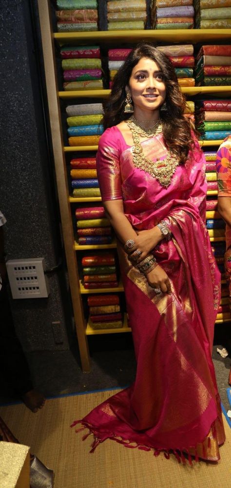 Shriya Saran in a pink pattu saree at shop opening Tomato Pink Saree Contrast Blouse, Dark Pink Pattu Saree, Jewellery For Pink Saree, Pink Pattu Blouse Designs, Pink Pattu Saree Contrast Blouse, Onion Pink Saree Contrast Blouse, Pink Saree Contrast Blouse, Pink Bridal Saree, Pink Pattu Saree