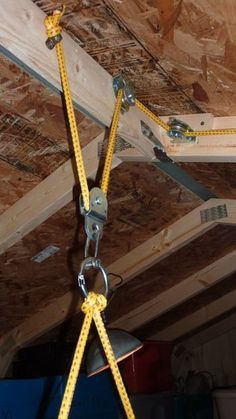 Rigging The Lifting Portion: Officine In Garage, Attic Lift, Diy Garage Work Bench, Diy Garage Storage Cabinets, Garage Door Makeover, Diy Garage Door, Diy Garage Shelves, Garage Work Bench, Diy Garage Storage