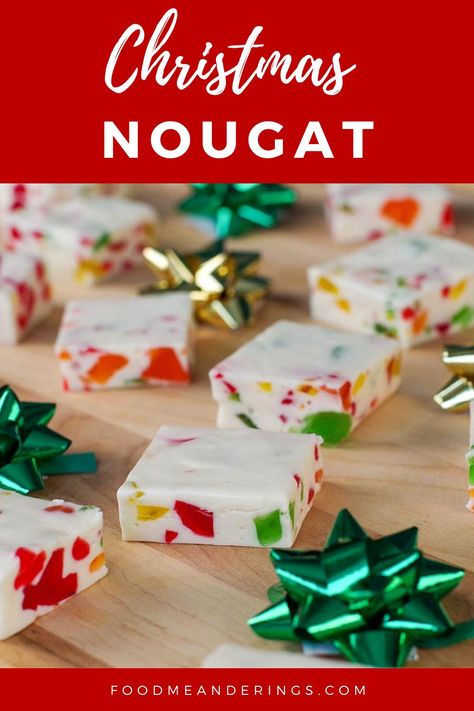 Nougat candy, cut into squares, on a wooden cutting board with green and gold mini bows Jujube Nougat Recipe, Christmas Nuggets Candy, Christmas Nougat Candy, Nougat Candy Recipes, Christmas Nougat, Nougat Cake, 2024 Holidays, No Bake Christmas, Divinity Candy