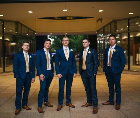 Grooms navy suits and gold ties ! Navy Suit Gold Tie Wedding, Navy Blue Suit With Gold Tie, Navy And Gold Suit Wedding, Navy Blue And Gold Suit Wedding, Navy Blue And Gold Bridal Party, Blue And Gold Chambelanes, Navy Blue And Gold Groomsmen Suits, Navy Blue And Rose Gold Tuxedo Wedding, Navy Suit With Gold Tie