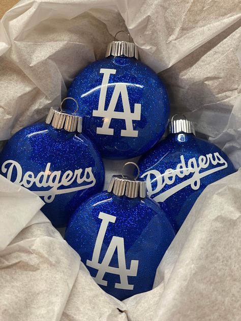 Add the perfect touch to your Christmas tree this year! These beautiful ornaments are sure to grab your guests attention. Disney Diy Christmas Ornaments, Baseball Christmas Tree, Disney Ornaments Diy, Vinyl Christmas Ornaments, Patriotic Christmas Ornaments, Baseball Christmas Ornaments, Christmas Glitter Ornaments, Cricut Ornaments, Baseball Ornaments