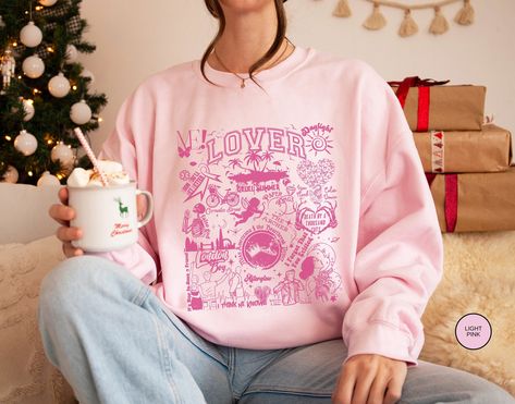 🌈 Dive into Valentine's Day with Our Exclusive Lover Sweatshirt! 💖 Embrace the enchanting vibes of the lover era with our fan made lover merch! This sweatshirt is perfect for girls in their lover era, whether it's for Christmas, birthdays, or just to spread the love. 🎶 Features: Front Design: The front boasts the entire tracklist of the Lover album, each song accompanied by adorable graphics that capture the essence of the lyrics. Gift: Ideal for the girls who adore the Lover era. Versatile Sizing and Colors: Available in sizes S to 5XL and 8 vibrant colors, ensuring the perfect fit and style for everyone Christmas Gift: Spread holiday cheer with a unique cruel summer tee Birthday Surprise: Make birthdays extra special for the lover girl in your life. 🖌️ Note on Colors: Colors may appe Eras Outfit, Lover Album, Romantic Aesthetic, Romantic Era, Lover Era, Lover Girl, Cruel Summer, Two Lovers, Lover Sweatshirt