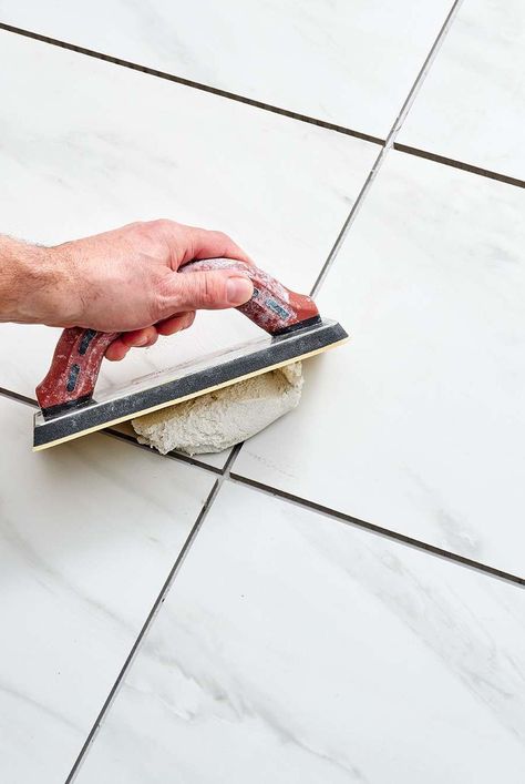 Grout is a necessary element of every tiled floor. Learn how to grout a tile floor and make it look perfect with this step-by-step guide. #homedecorideas #remodeltips #renovationideas #thespruce How To Regrout Tile Floor, How To Grout Tile Floor, Grouting Tile Tips, Tile Hacks, How To Grout, Floor Tile Grout, Floor Grout, Tiled Floor, Tile Table