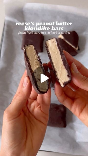 Ruth Anne Bigley on Instagram: "reese’s peanut butter klondike bars! they’re gluten free, dairy free, and refined sugar free, so easy to make, and soo dang good!

ice cream layer:
•1 can (13.5oz) full fat canned coconut milk
•1/2 cup peanut butter (or you can use 1 cup peanuts if you have a high speed blender)
•1/3 cup raw honey or pure maple syrup 
•1 tsp pure vanilla extract
•1/2 tsp salt (use 1/4 tsp if using salted peanut butter or peanuts)

chocolate shell:
•10oz dark or semi-sweet chocolate (i used dairy free and refined sugar free)
•2 tbsp coconut oil

instructions:
1. add the ice cream ingredients to a high speed blender and blend until smooth and creamy. pour the mixture into a 8x8 square pan lined with parchment paper and place in the freezer until frozen solid, at least 8+ hours Freeze Desserts, Klondike Bar, Ice Cream Ingredients, Square Pan, Pure Vanilla, Reeses Peanut Butter, Vegan Ice Cream, Canned Coconut Milk, Icecream Bar