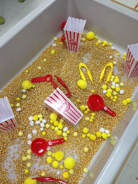 Fun Sensory Table Ideas, Circus Sensory Bin Preschool, Movie Sensory Bin, Carnival Theme Sensory Bin, Circus Tuff Tray Ideas, Cotton Candy Sensory Bin, Circus Themed Sensory Bin, Sensory Carnival Activities, Theme Sensory Bin Ideas