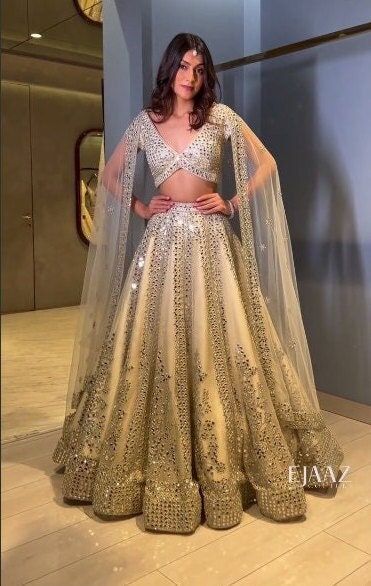 Most Beautiful Lehenga, Sequence Blouse Design, Beige Lehenga, Sabyasachi Designer, Golden Lehenga, Sequence Lehenga, Haldi Dress, Beautiful Lehenga, Wedding Lehenga Choli