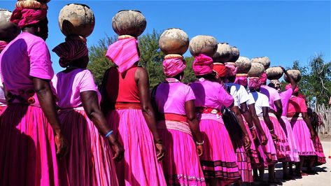 If you are spending some time in Windhoek, have a peak around as there will be various shades of pink, luring you to purchase a shirt or dress.  Read more here https://www.gondwana-collection.com/blog/where-in-namibia-can-you-get-that-pink-aawambo-traditional-attire/ #tradition #pink #aawambo #attires #namibia Traditional Wedding Styles, Royalty Dress, Victorian Fashion Dresses, African Royalty, Culture Day, Traditional Dresses Designs, Traditional Outfit, Career Fashion, Traditional Music