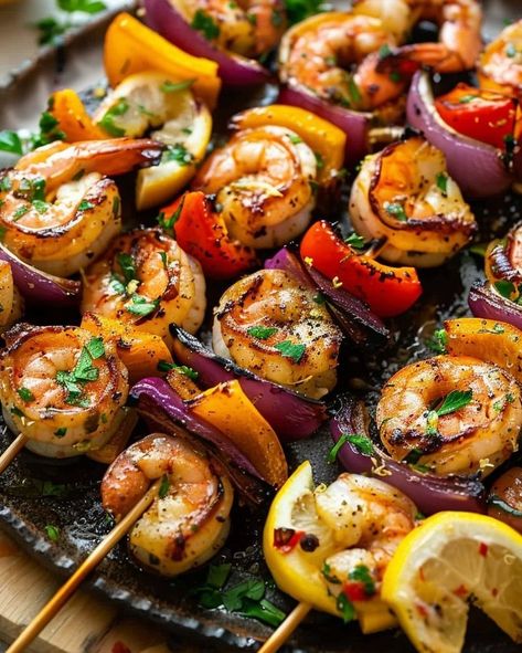 Grilling season is here! Kick it off with these mouth-watering Lemon Garlic Shrimp Skewers. Perfect for your next BBQ! Visit website for full recipe at https://northeastnosh.com/f/lemon-garlic-shrimp-skewers #northeastnosh #grilledshrimp #lemon #garlic #skewers #healthydinner #summercooking #grillseason #shrimpskewers #vegetableskewers #easyrecipes #weeknightdinner #seafoodrecipes #paleofriendly #glutenfree #dinnerideas #cookingathome #grilling #flavorful #homemade #freshingredients Shrimp Bbq Recipes Skewers, Shrimp Skewers Grill, Garlic Shrimp Skewers, Bbq Shrimp Skewers, Crunchy Food, Grilled Shrimp Skewers, Vegetable Skewers, Lemon Garlic Shrimp, Main Entrees