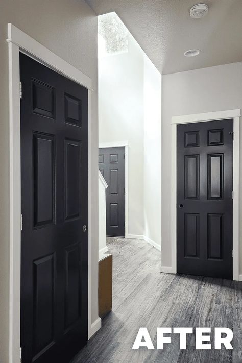 Interior doors transformed with a sleek black paint, adding a touch of modern sophistication to the space. A striking statement that complements any decor. Dark Brown Doors With White Trim, Farmhouse Interior Black Doors, Grey Walls Black Doors White Trim, Black Interior Doors With White Trim Grey Walls Paint Colors, Painted Office Doors, Peppercorn Doors, Charcoal Interior Doors, Urban Bronze Interior Doors, Hallway With Black Doors