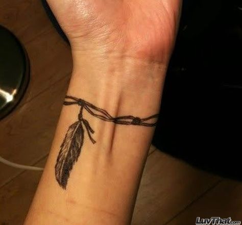 feather on a string wrist tattoo Armband Tattoo Frau, Tattoo Bunt, Wrist Tattoos Girls, Tatuagem Masculina Pequena, Band Tattoo Designs, Armband Tattoo Design, Feather Tattoo Design, Anklet Tattoos, Wrist Tattoos For Guys