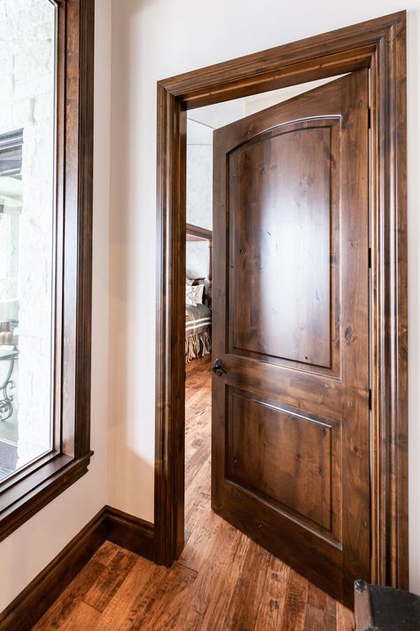 This large natural wood door is a timeless piece. And when combined with natural wood trim and natural wood flooring, it becomes a timeless masterpiece. Woodgrain Doors offers doors like this one as well as many other varieties. Check them out! Stained Interior Doors, Interior Doors Stained, Natural Wood Door, Stained Wood Trim, Natural Wood Trim, Dark Wood Trim, Wood Baseboard, Stained Trim, Dark Doors