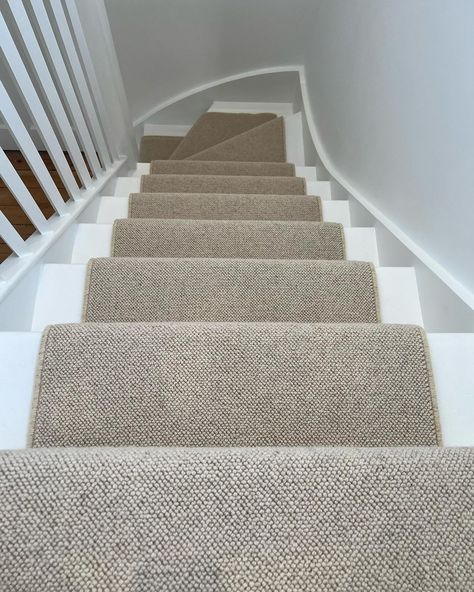 A white staircase with a wool carpet runner. The runner is a soft brown/beige. Loop Carpet Stairs, Loop Pile Carpet Bedroom, Wool Carpet Stairs, Wool Loop Carpet, Carpet Stair Runner, Loop Pile Carpet, 1930s Semi, Hall Stairs, Stairs Landing