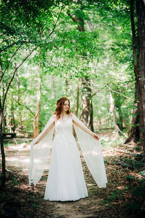 Wedding dress with long, graceful sleeves, great for a lord of the rings wedding Lord Of The Rings Wedding Dress, Wedding Dresses For 2023, Lord Of The Rings Wedding, Traditional Wedding Vows, Unique Wedding Gowns, Unique Wedding Dresses, Wedding Cape, Cocktail Dress Wedding, Dress Stand