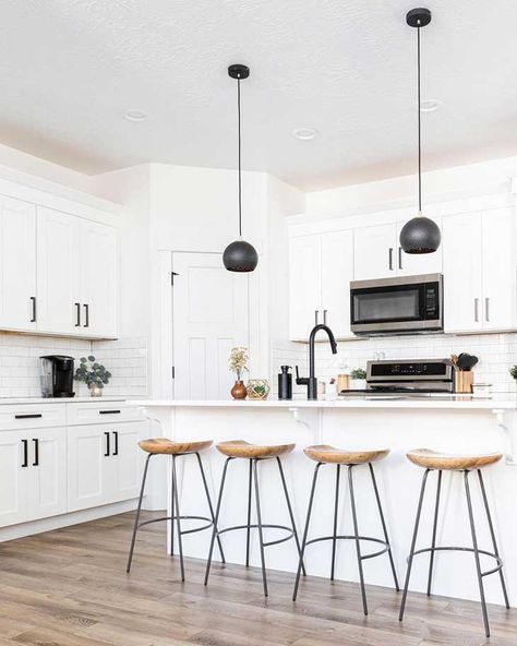 Breathtaking Kitchen Island Lighting Ideas You'll Immediately Want - Farmhousehub White Kitchen With Black Hardware, Kitchen With Black Hardware, Rustic Farmhouse Kitchen Island, Robin House, Contemporary Dining Room Lighting, Kitchen Island Lighting Ideas, Kitchen Island With Cooktop, Farmhouse Kitchen Island Lighting, Kitchen Expansion