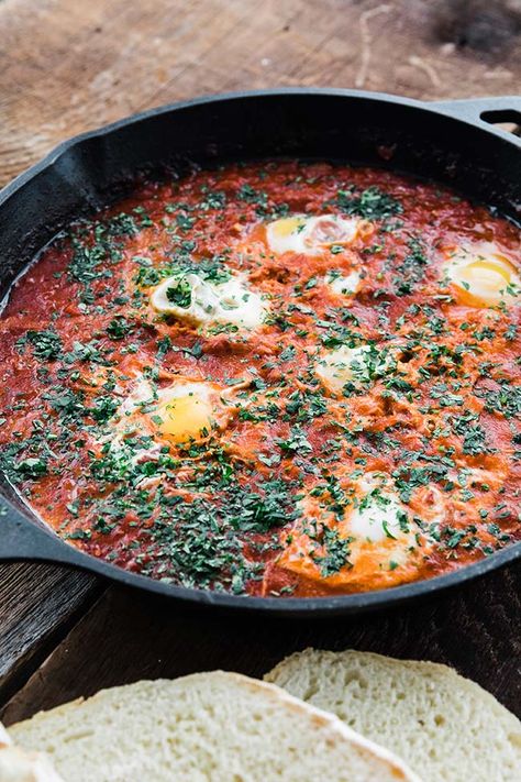 This delicious Shakshuka recipe is a blend of peppers, onions, spices, and tomatoes stewed down and served with poached eggs. Eggs In Sauce, Sweet Toast, Shakshuka Recipe, Chef Billy Parisi, Billy Parisi, Shakshuka Recipes, Whole 30 Meal Plan, Homemade Chicken Stock, Sausage Bake