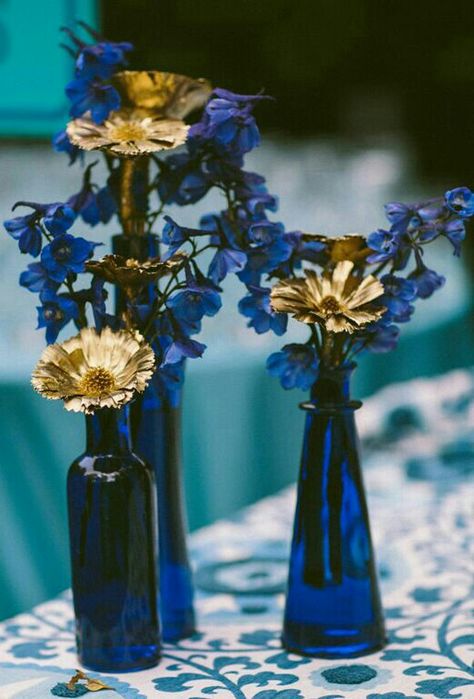 Beautiful bold blue centerpies mix in vintage gold candleholders of different sizes to complete the look Navy Blue And Gold Wedding, Blue Centerpieces, Silver Centerpiece, South Shore Decorating, Gold Rooms, Bottle Centerpieces, Gold Centerpieces, Royal Blue Wedding, Royal Blue And Gold