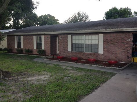 The front of my house needed a drastic facelift and some curb appeal. I really disliked how plain it looked, so this is what I came up with. Staining the brick, adding fresh landscaping and a newly built front porch pergola really seemed to do the trick. Hope you enjoy!   These first two pictures are before. Very plain and unappealing.   Before: Pic 2   I used a semi-transparent concrete stain (English Brick) from Home Depot to give the brick some life again. Here is a side-by-side com… Build A Front Porch, Front Porch Pergola, Porch Pergola, Pergola Diy, Pergola Swing, Porch Planters, Diy Front Porch, Diy Porch, Red Brick House