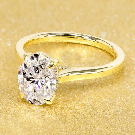 Classic Sofia 2ct Oval-cut Diamond Bridge Hidden Halo Cathedral Style Solitaire Engagement ring in 14K Solid Gold. Handcrafted in 14K Gold, this timeless and classic Sofia engagement ring features a 2 carats oval-cut moissanite on a low-profile hidden halo setting surrounded by lab-grown diamonds set in a beautiful cathedral setting. With a subtle and elegant touch of lustrous diamonds going across above the finger, our Sofia collection is the ideal ring for those looking for a style that is cla Low Profile Engagement Ring, Engagement Rings 4 Carat, Hidden Halo Ring, Halo Band, Cathedral Engagement Rings, Cathedral Setting, Classic Engagement Ring, Classic Engagement, Halo Setting