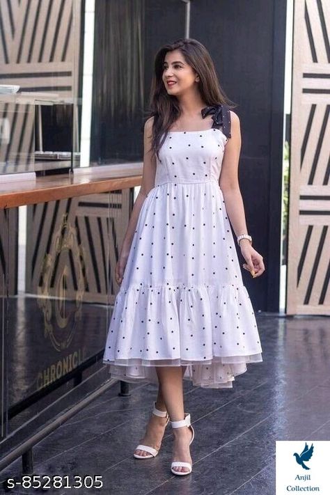 White Polka Print Full Flared Dress Name: White Polka Print Full Flared Dress Fabric: Crepe Sleeve Length: Sleeveless Pattern: Printed Net Quantity (N): 1 Sizes: S (Bust Size: 34 in, Length Size: 44 in) M (Bust Size: 36 in, Length Size: 44 in) L (Bust Size: 38 in, Length Size: 44 in) XL (Bust Size: 40 in, Length Size: 44 in) XXL (Bust Size: 42 in, Length Size: 44 in) A beautiful polka print full flared white dress has a round neck contrast shoulder straps in bow design ruffled flared Western Dress Poses For Women, Simple White Frock Design, Poses In Long Dresses, Cute Frocks For Women, White Frocks For Women, Long Dress Poses, Polka Dot Long Dress, Shaurya Sanadhya, Western Dresses Online