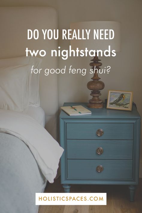 Photo of blue nightstand with lamp, picture, and journal next to bed. Text: do you really need two nightstands for good feng shui? holisticspaces.com Feng Shui Bedroom Nightstand, Bedroom One Nightstand Ideas, Matching Nightstands Bedroom, Only One Nightstand In Bedroom, One Bedside Table In Bedroom, Bedroom With Only One Nightstand, Single Nightstand Bedroom Layout, Feng Shui Nightstand, Bedroom No Nightstand